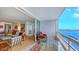 Relaxing balcony with seating and expansive water views, adjacent to the living area at 988 Blvd Of The Arts # 1016, Sarasota, FL 34236