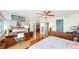 Spacious bedroom features workstation, water view and decorative, mirrored wall at 988 Blvd Of The Arts # 1016, Sarasota, FL 34236
