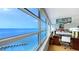 Bedroom with expansive windows provides breathtaking bay views and a workstation at 988 Blvd Of The Arts # 1016, Sarasota, FL 34236