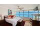 Bedroom features large windows with bay views and a decorative color palette at 988 Blvd Of The Arts # 1016, Sarasota, FL 34236