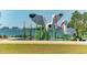 Sculptural bird play structures overlook the water, offering a unique recreational area for children at 988 Blvd Of The Arts # 1016, Sarasota, FL 34236