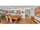 Bright dining room features a mirrored wall, modern art decor and an open concept to the kitchen at 988 Blvd Of The Arts # 1016, Sarasota, FL 34236