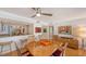 Open dining area with modern lighting, stylish seating, and an open kitchen view at 988 Blvd Of The Arts # 1016, Sarasota, FL 34236