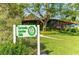 Charming Sarasota Garden Club nestled amidst lush greenery, inviting visitors to explore its beauty at 988 Blvd Of The Arts # 1016, Sarasota, FL 34236
