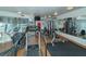 Bright gym showcasing treadmills, weight machines, and mirror views of workout area at 988 Blvd Of The Arts # 1016, Sarasota, FL 34236