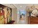 Inviting hallway with stylish decor, leading to a view of the water and living spaces at 988 Blvd Of The Arts # 1016, Sarasota, FL 34236