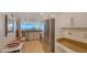 Bright kitchen features stainless appliances, granite counters and ocean views at 988 Blvd Of The Arts # 1016, Sarasota, FL 34236