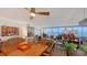 Bright and airy living room with waterfront views, modern décor, and ample seating at 988 Blvd Of The Arts # 1016, Sarasota, FL 34236