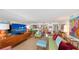 This living room features a wall mirror reflecting ocean views, a hardwood floor, and modern art decor at 988 Blvd Of The Arts # 1016, Sarasota, FL 34236