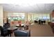 Inviting lounge area with comfortable sofas, chairs, and scenic ocean views at 988 Blvd Of The Arts # 1016, Sarasota, FL 34236