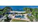 Playground along bay with a beach, palm trees, grassy area, and covered tables at 988 Blvd Of The Arts # 1016, Sarasota, FL 34236
