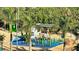 Community playground near a park with green space and a picnic area under a covered structure at 988 Blvd Of The Arts # 1016, Sarasota, FL 34236
