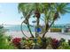 Unique sculpture amidst lush landscaping with water views, enhancing community aesthetics at 988 Blvd Of The Arts # 1016, Sarasota, FL 34236