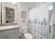 Cozy bathroom with blue seashell theme and shower/tub combination at 10423 Morning Marsh Ln, Parrish, FL 34219
