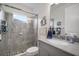 Modern bathroom featuring gray tile, glass shower, and granite vanity at 10423 Morning Marsh Ln, Parrish, FL 34219