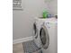 Efficient laundry room with modern appliances and clean, organized space at 10423 Morning Marsh Ln, Parrish, FL 34219