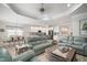 Spacious living area with kitchen and dining room; features tile floors and modern decor at 10423 Morning Marsh Ln, Parrish, FL 34219