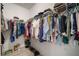 Well-organized walk-in closet with clothing racks and shelves offering ample storage space at 10423 Morning Marsh Ln, Parrish, FL 34219