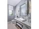 Stylish bathroom features a modern vanity, granite countertops, and decorative lighting at 1198 Blue Shell Loop, Sarasota, FL 34240