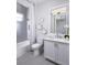 Clean bathroom with white cabinetry, a shower-tub combo, and modern fixtures at 1198 Blue Shell Loop, Sarasota, FL 34240