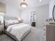 Inviting bedroom offers a comfortable bed, soft lighting, and a serene atmosphere at 1198 Blue Shell Loop, Sarasota, FL 34240