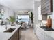 Modern kitchen with stainless steel appliances, sleek countertops, and an adjacent dining area at 1198 Blue Shell Loop, Sarasota, FL 34240