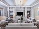 Sophisticated living room showcasing stylish furnishings, a tray ceiling, and a modern aesthetic at 1198 Blue Shell Loop, Sarasota, FL 34240