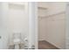 Half bathroom with adjacent walk-in closet featuring wire rack shelving at 12515 Garibaldi Ln, Venice, FL 34293