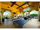 View of a common area with a ping pong table, fireplace, and a tv at 12515 Garibaldi Ln, Venice, FL 34293