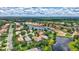 Overhead shot of the house with pond view, landscaped backyard at 12710 Stone Ridge Pl, Lakewood Ranch, FL 34202