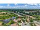 Picturesque aerial view features home with pond view and lush landscaping at 12710 Stone Ridge Pl, Lakewood Ranch, FL 34202