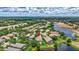 Aerial view features pond, backyard, and landscaping of home at 12710 Stone Ridge Pl, Lakewood Ranch, FL 34202