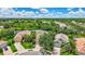 View of multiple houses, with beautiful landscape, bodies of water, and a golf course off in the distance at 12710 Stone Ridge Pl, Lakewood Ranch, FL 34202