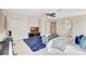 Large bedroom featuring a rug, bed, television, and musical instruments at 12710 Stone Ridge Pl, Lakewood Ranch, FL 34202