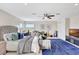 Large bedroom featuring a rug, bed, television, and musical instruments at 12710 Stone Ridge Pl, Lakewood Ranch, FL 34202