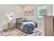 Comfortable bedroom with neutral tones, a comfortable bed, and bright sunlight at 12710 Stone Ridge Pl, Lakewood Ranch, FL 34202
