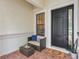 Inviting entryway seating area with comfortable chair, complemented by a 'Welcome' mat at 12710 Stone Ridge Pl, Lakewood Ranch, FL 34202