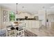 Bright kitchen boasts granite countertops, stainless steel appliances, an island and breakfast nook with plenty of room at 12710 Stone Ridge Pl, Lakewood Ranch, FL 34202