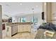 Open kitchen with granite countertops, stainless appliances, and views of the living area at 12710 Stone Ridge Pl, Lakewood Ranch, FL 34202