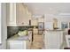 Bright kitchen features granite countertops, backsplash, stainless appliances, and a center island for food preparation at 12710 Stone Ridge Pl, Lakewood Ranch, FL 34202
