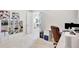 Office area with white shelving and views into the home at 12710 Stone Ridge Pl, Lakewood Ranch, FL 34202