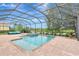 Inviting pool and spa under screened enclosure offer stunning backyard and lake scenery at 12710 Stone Ridge Pl, Lakewood Ranch, FL 34202