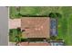 An aerial view of a single Gathering home featuring a tile roof, screened-in pool, and lush lawn at 14216 Florida Rosemary Dr, Bradenton, FL 34211