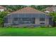 A spacious screened-in patio features a pool, spa, and an outdoor lounge area at 14216 Florida Rosemary Dr, Bradenton, FL 34211