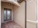 Stylish front entryway with a decorative glass door, brick pavers, a transom window, and a modern light fixture at 14216 Florida Rosemary Dr, Bradenton, FL 34211