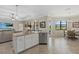 Bright, open kitchen boasts granite countertops, stainless steel appliances, and seamless flow to the living and dining areas at 14216 Florida Rosemary Dr, Bradenton, FL 34211