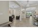 Spacious living area featuring tiled floors, recessed lighting, and seamless access to outdoor living spaces at 14216 Florida Rosemary Dr, Bradenton, FL 34211