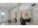 Inviting sitting room with four chairs, tiled floors, chandelier, and stylish decor enhancing the home's appeal at 14216 Florida Rosemary Dr, Bradenton, FL 34211