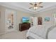 Main bedroom with an ensuite bathroom, a walk-in closet, and a flat screen television at 14216 Florida Rosemary Dr, Bradenton, FL 34211