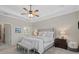 Main bedroom with a view to a bathroom and a neutral color palette for a serene atmosphere at 14216 Florida Rosemary Dr, Bradenton, FL 34211